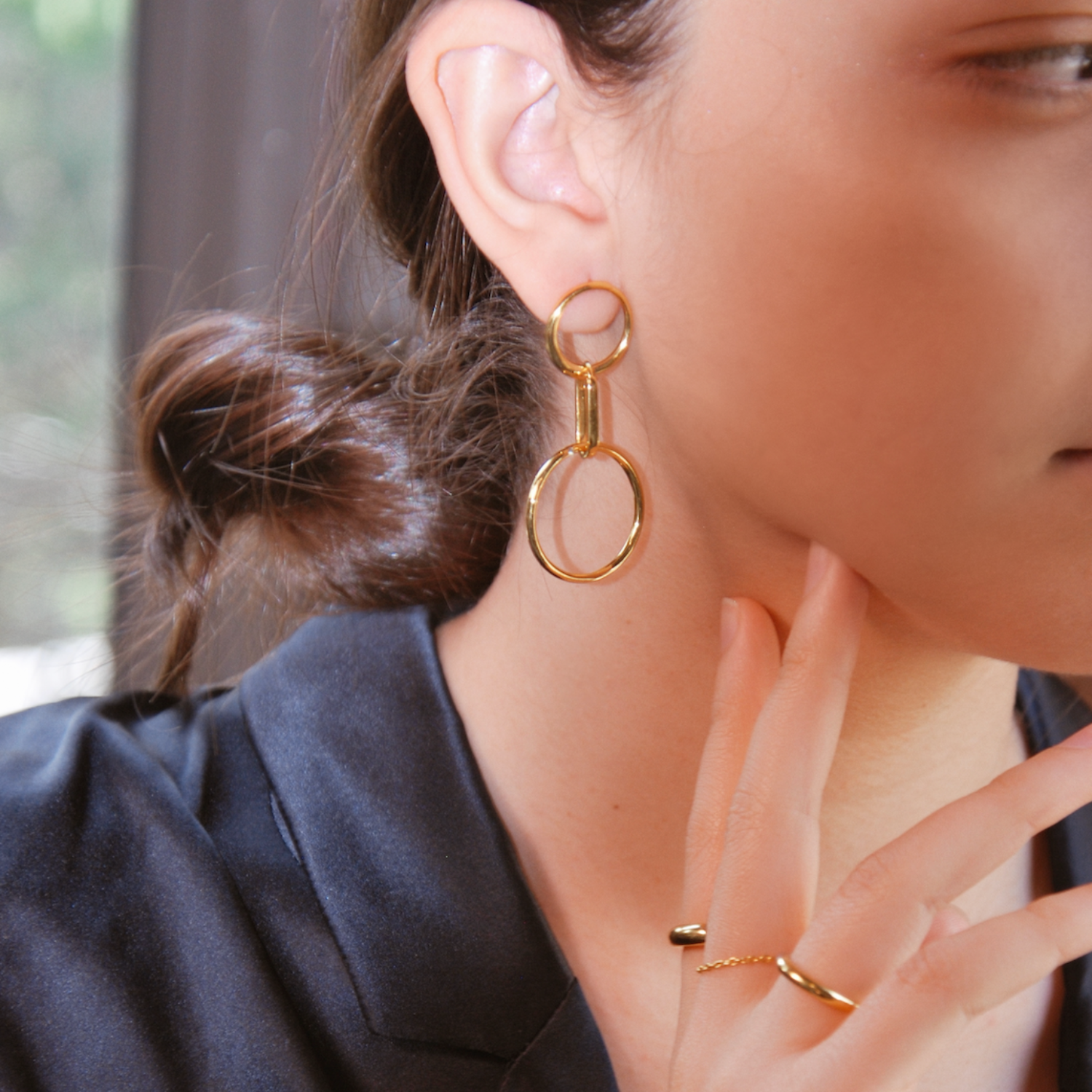 gold, earrings, hand, face, ring, bun, shirt