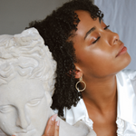 earrings, gold, statue, skin, lips, face, hair, rings